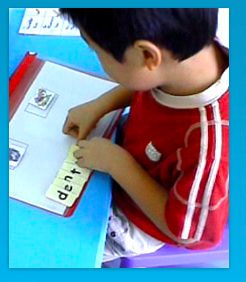 A young boy learning how to spell